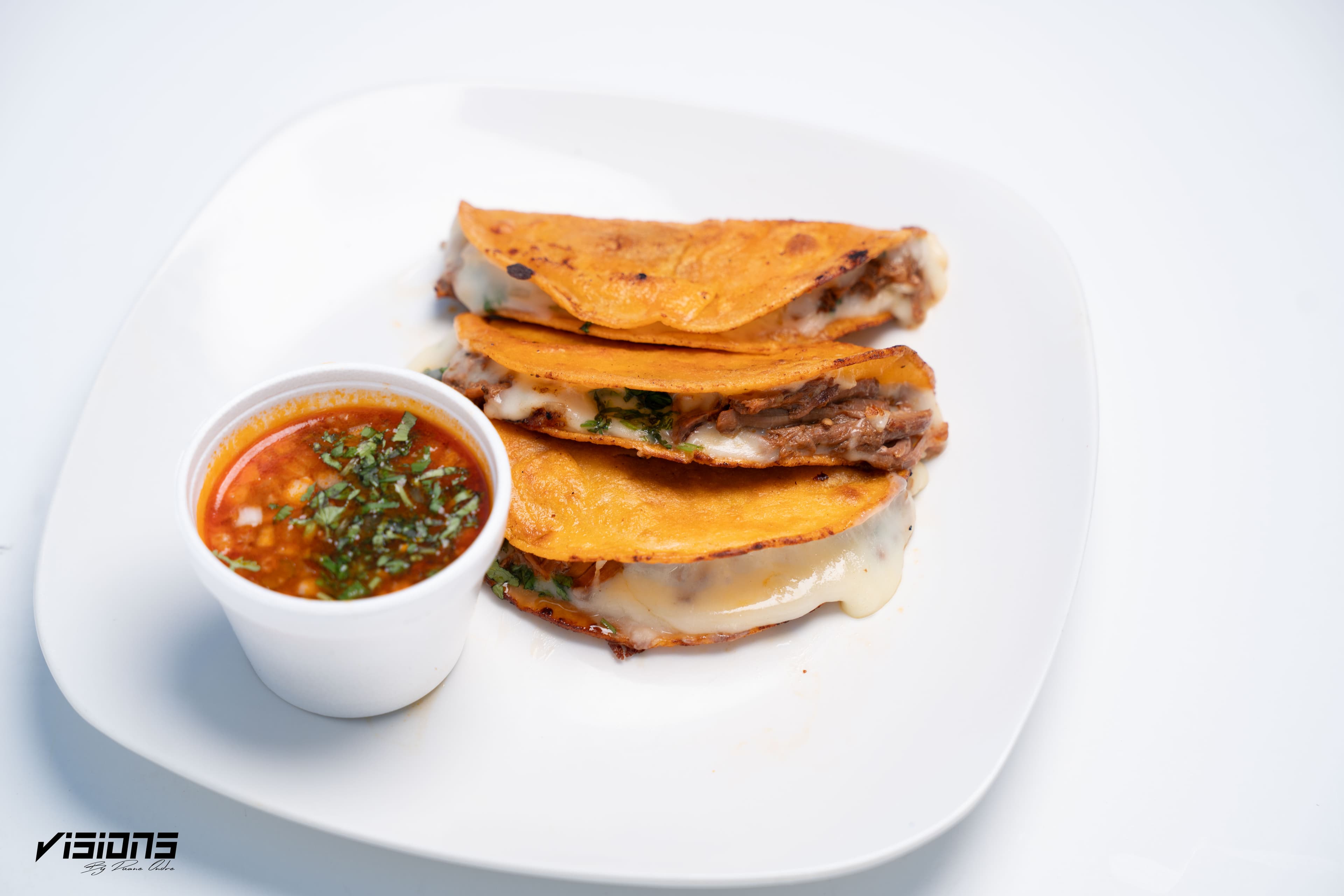Catrinas quesabirrias served with consommé